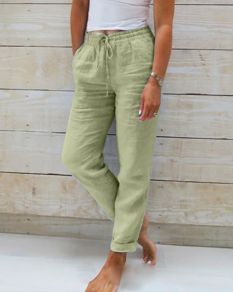 Women's straight leg pants featuring an adjustable drawstring elastic waist, offering effortless comfort.