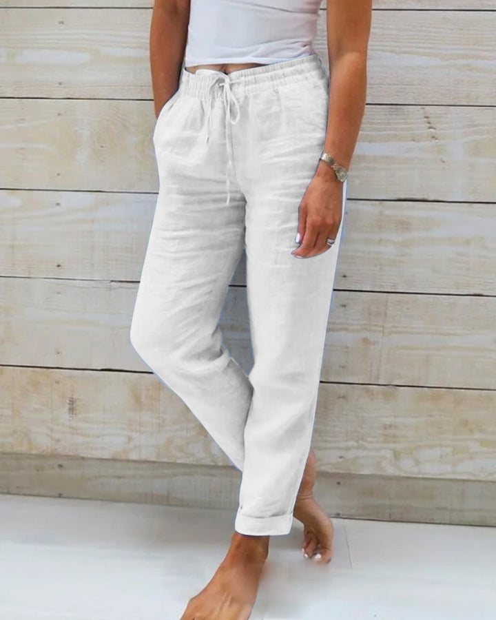 Model wearing versatile women's straight leg pants with drawstring, perfect for casual spring & summer style.