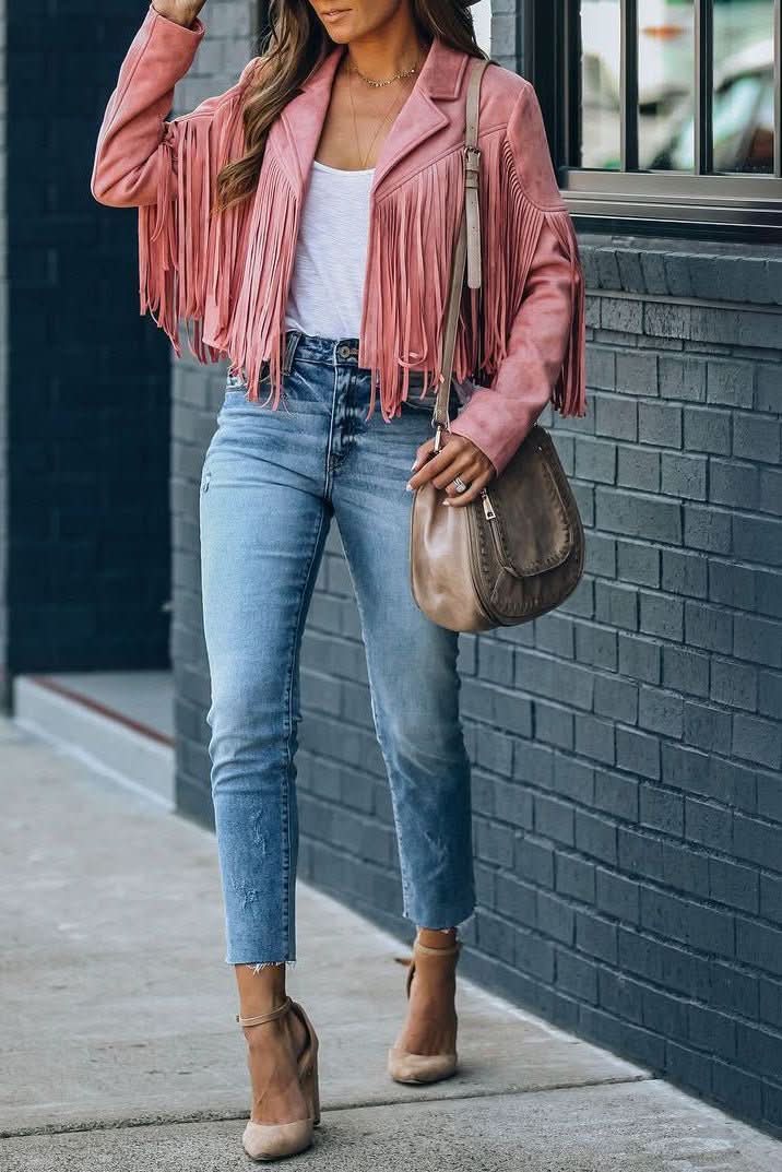 Stylish women's fringed moto jacket in black, a unique outerwear statement piece for fall & spring.