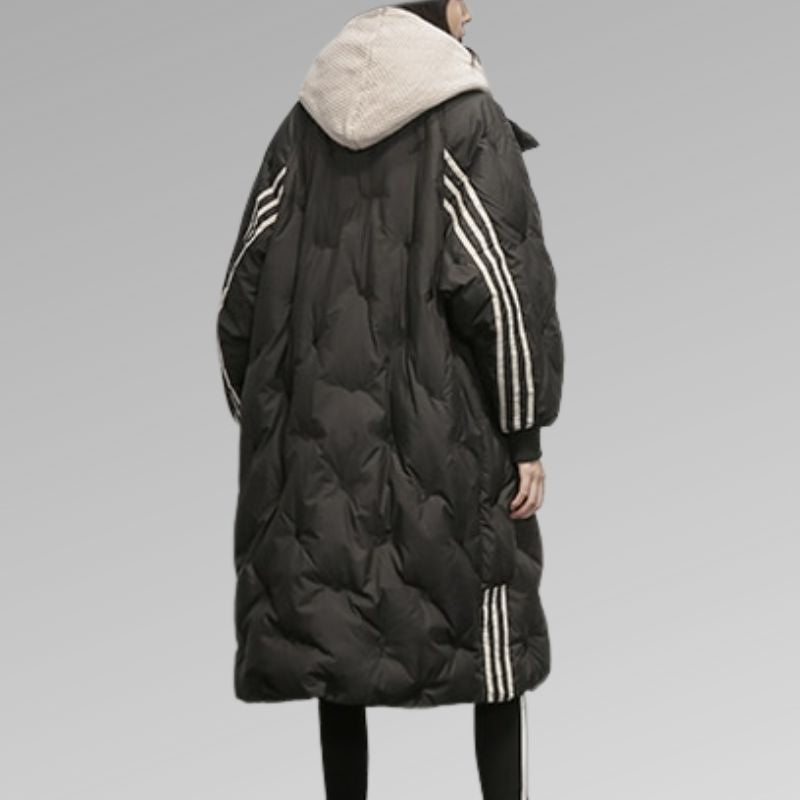 Warm insulated women's long padded jacket for winter, essential cold weather outerwear & fashion.