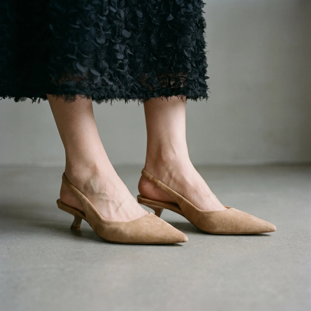 Women's black kitten heel slingback sandals with pointed toe. Elegant & stylish for office wear or evening events.