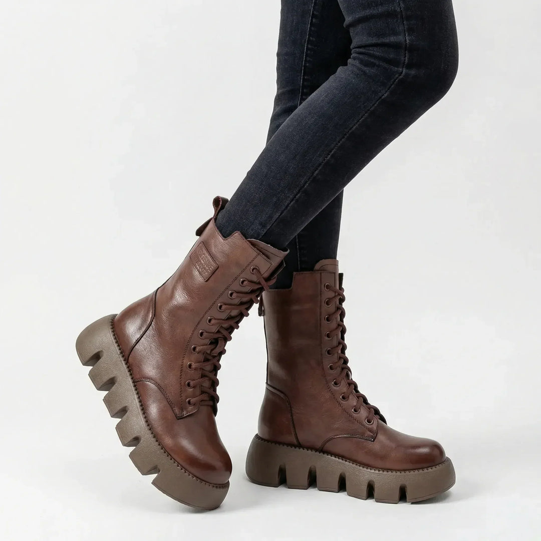 Stylish women's black platform combat boots, lace-up design, with arch support for comfort and non-slip sole.