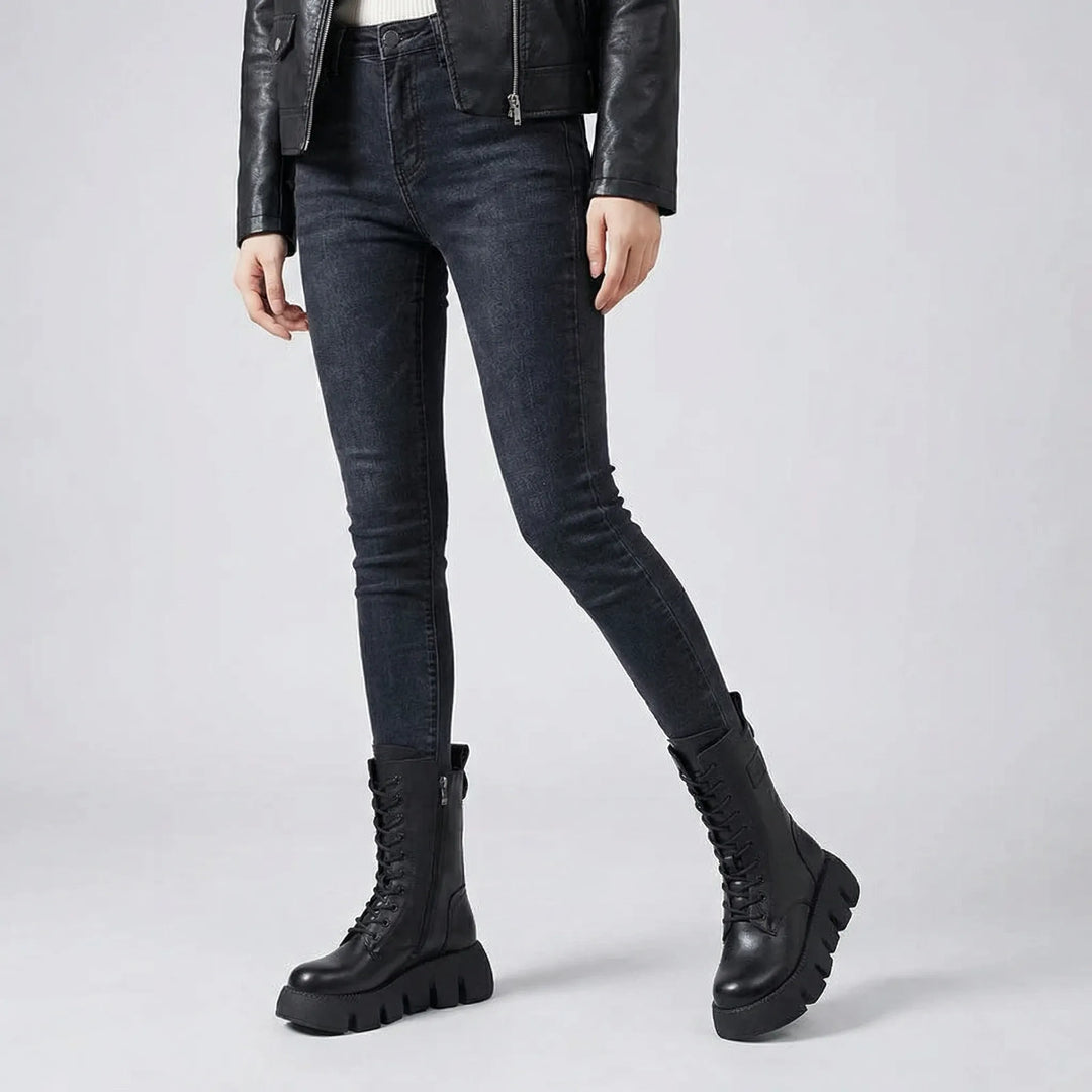 Edgy women's platform combat boots worn, featuring lace-up design, arch support, perfect for fall fashion.