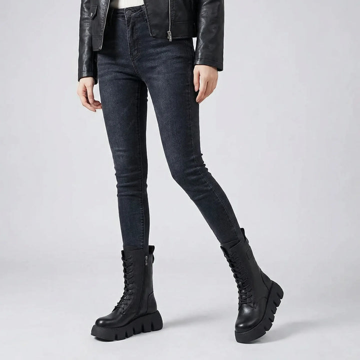 Edgy women's platform combat boots worn, featuring lace-up design, arch support, perfect for fall fashion.