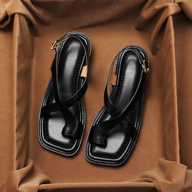 Close-up of the soft leather cross straps on women's comfort sandals, adjustable design