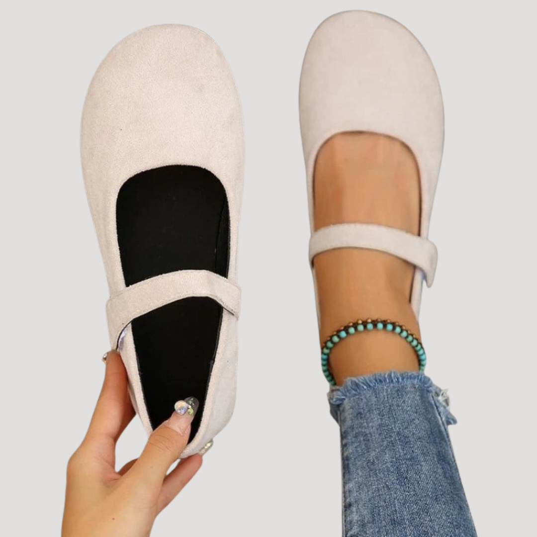 Women's black Mary Jane flats with comfy cushioning & easy Velcro strap.