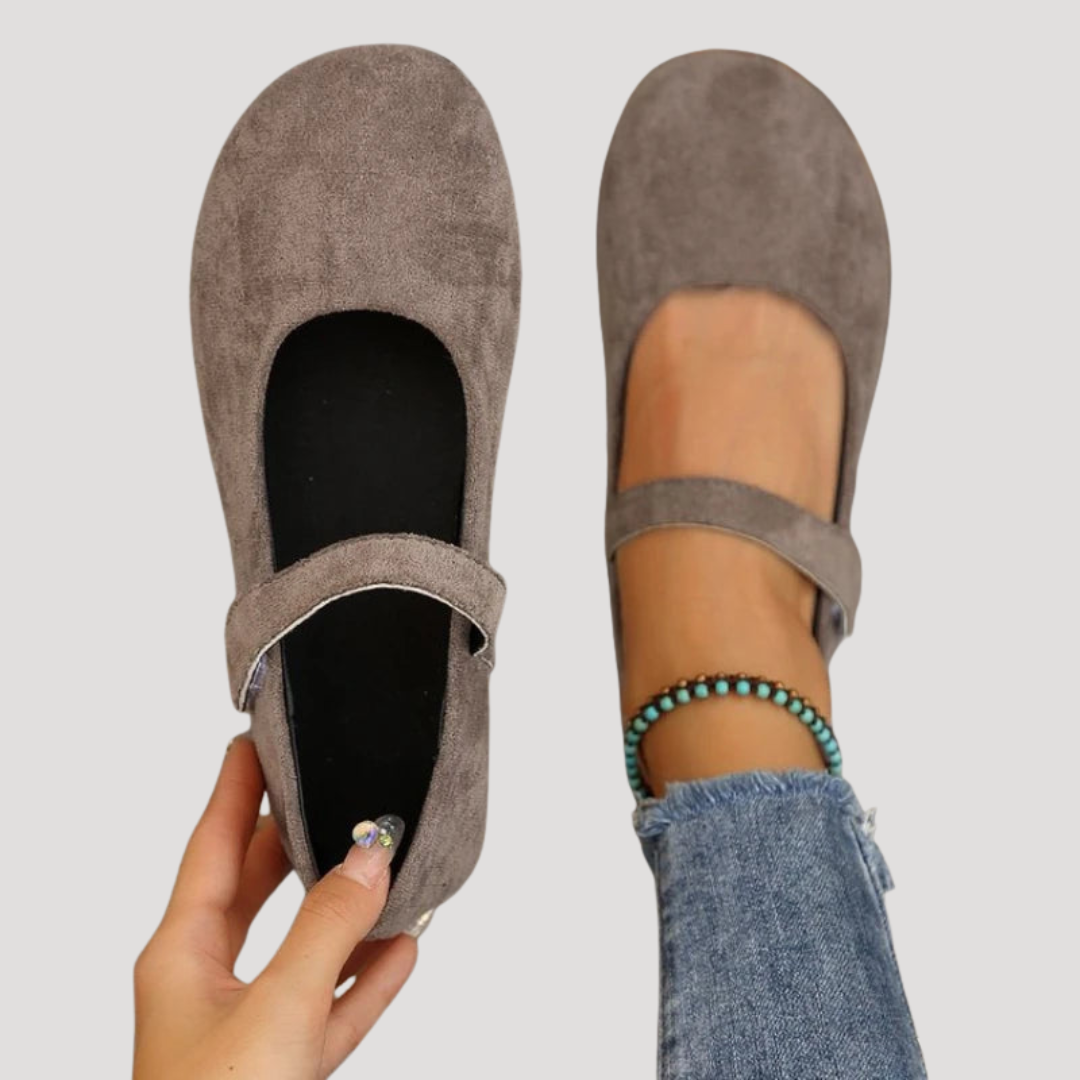 Cushioned women's Mary Jane flats with adjustable Velcro strap for all-day comfort.