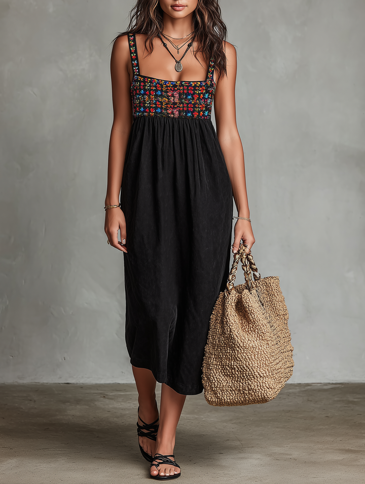 Women's black midi dress with vibrant floral embroidery, square neck, and sleeveless design for a elegant summer look.