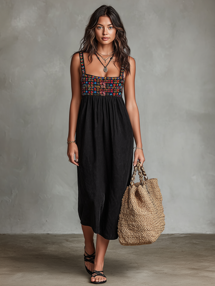 Floral embroidered black midi dress with square neck, sleeveless design, and a comfortable, flowing skirt for women.