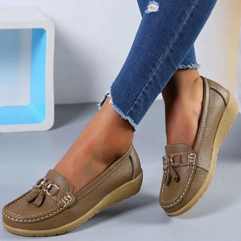 Women's black orthopedic comfort loafers. Stylish slip-on flats for everyday wear, offering excellent foot support.