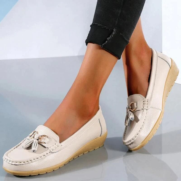 Modern women's orthopedic comfort loafers. Stylish slip-on flats, perfect for work or casual outings, with support.