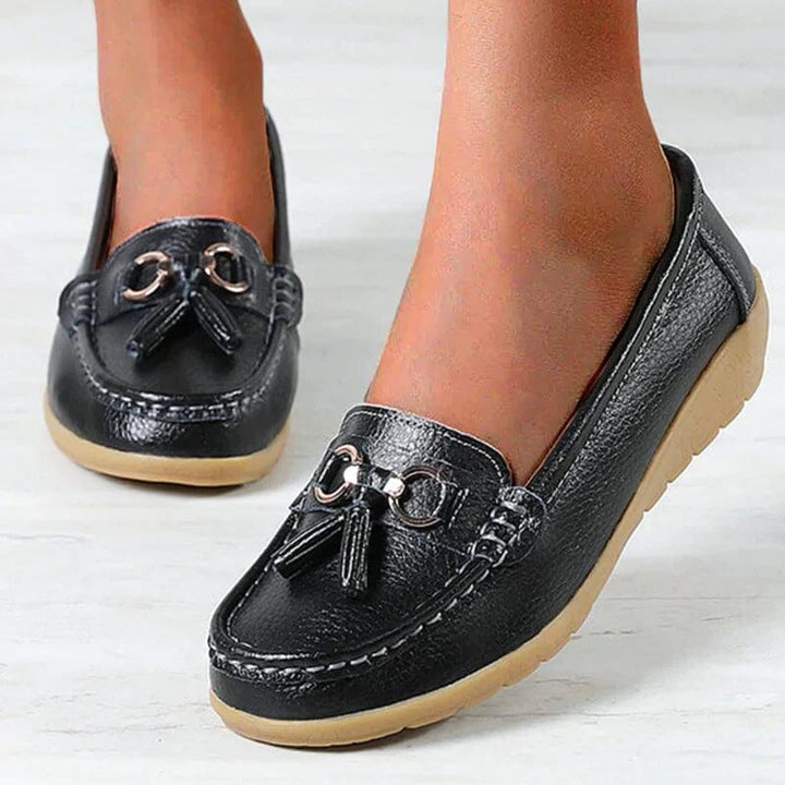 Tan orthopedic comfort loafers for women. Slip-on walking shoes with arch support, perfect for casual everyday wear.
