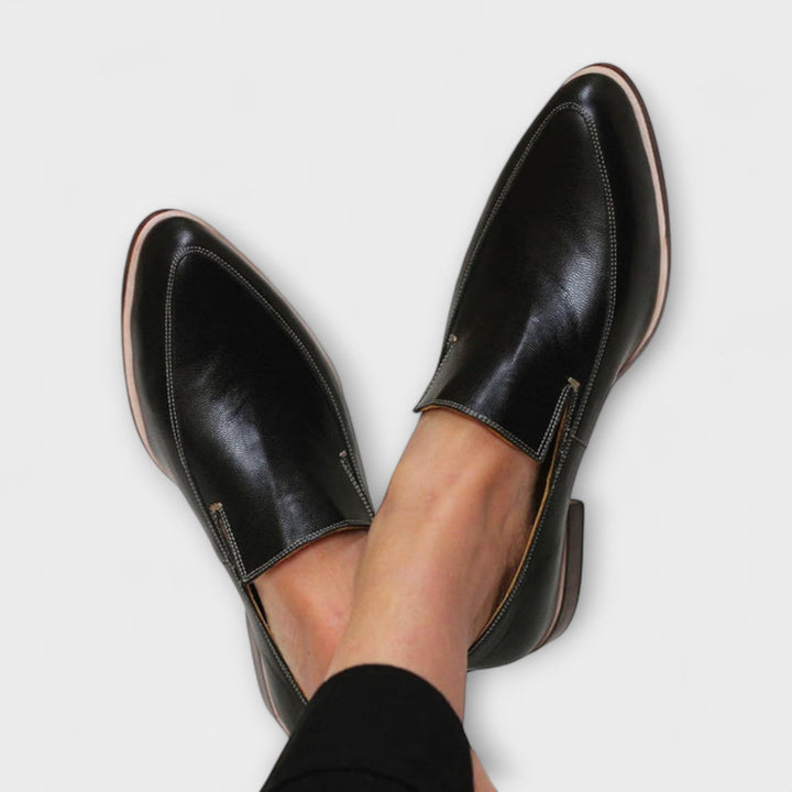 Women's black orthopedic loafers for all-day comfort, support, and foot health. Ideal for walking & casual wear.