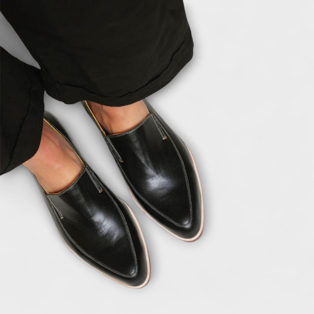 Comfortable women's slip-on orthopedic loafers in black, offering supportive footwear for versatile casual and dress styles.