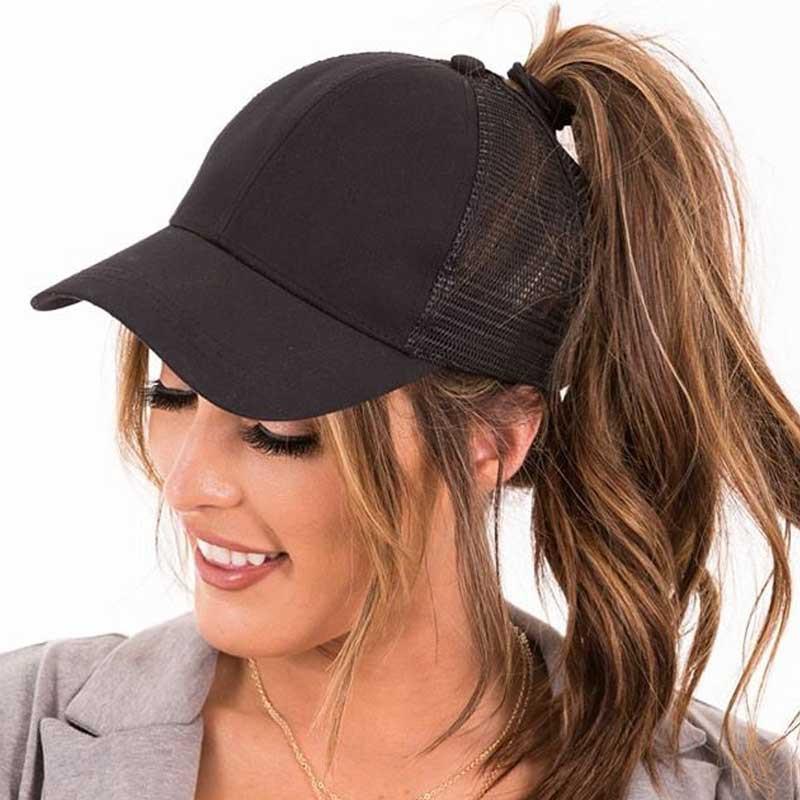 Women's black ponytail baseball cap with a high hair opening, perfect for buns & high ponytails. Adjustable SkyShield hat.