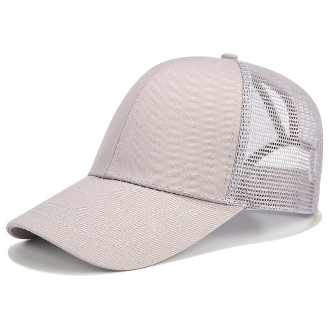 Stylish black women's baseball cap with a high ponytail opening. Comfortable and practical hair accessory for sun.