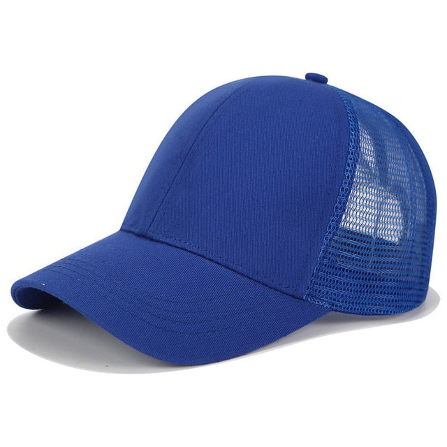 SkyShield women's black baseball cap, designed for high ponytails & buns. Adjustable, ideal for workouts & sun.