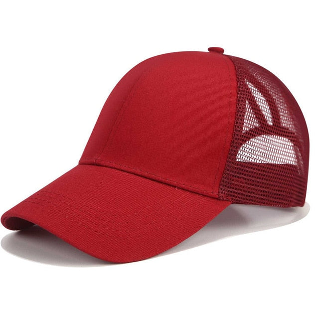 Practical black women's hair accessory: a SkyShield baseball cap with a high opening for ponytails & buns.