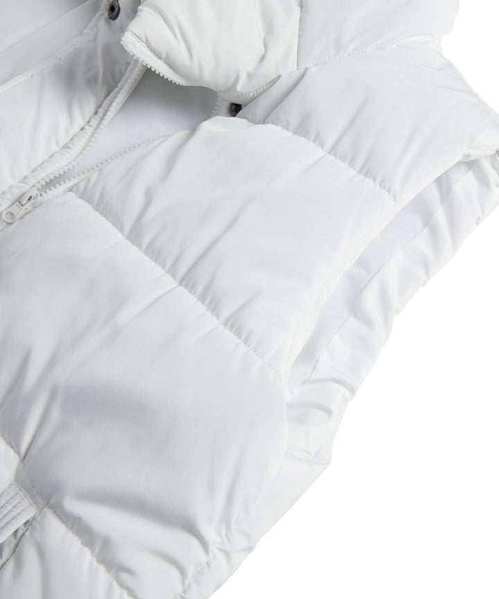 Sleek women's quilted longline vest, an excellent addition to any winter wardrobe.