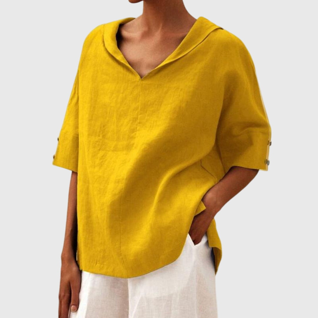 Elegant black relaxed fit women's blouse. Long sleeve top offering everyday comfort and casual versatility.