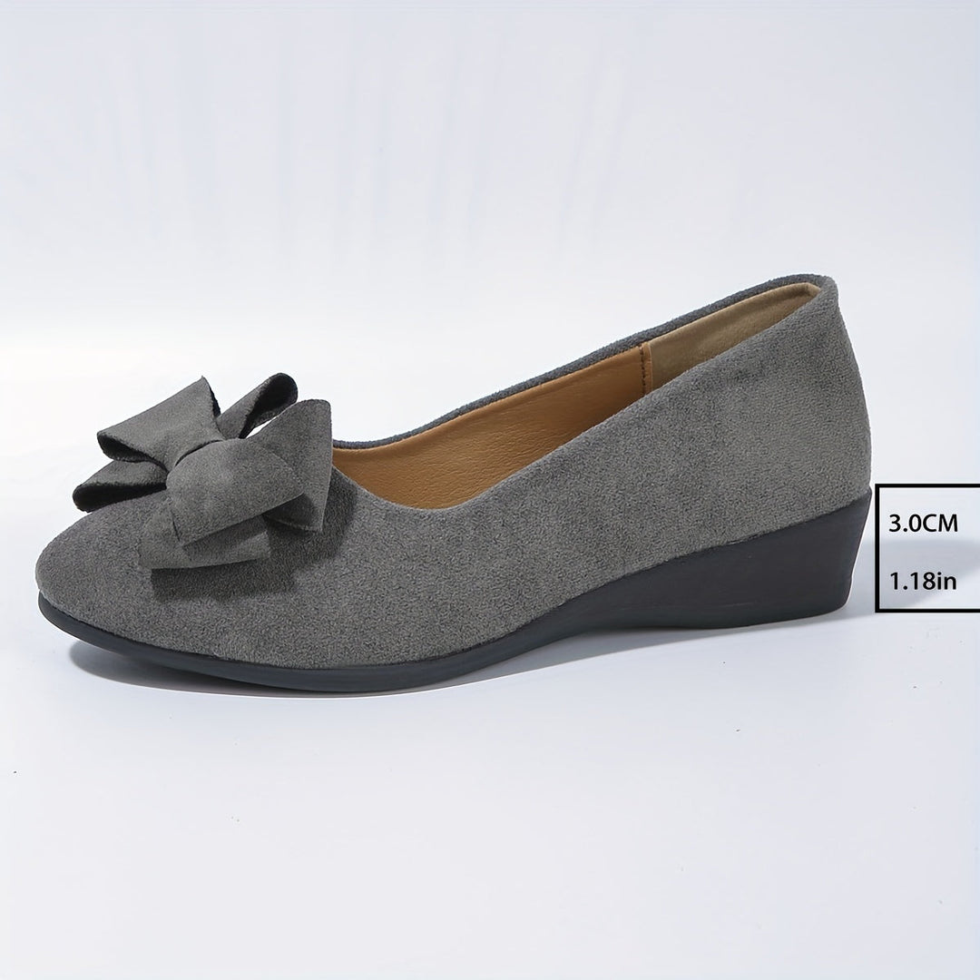 Women's casual elegant flats; round toe, bow detail, comfortable wedge.