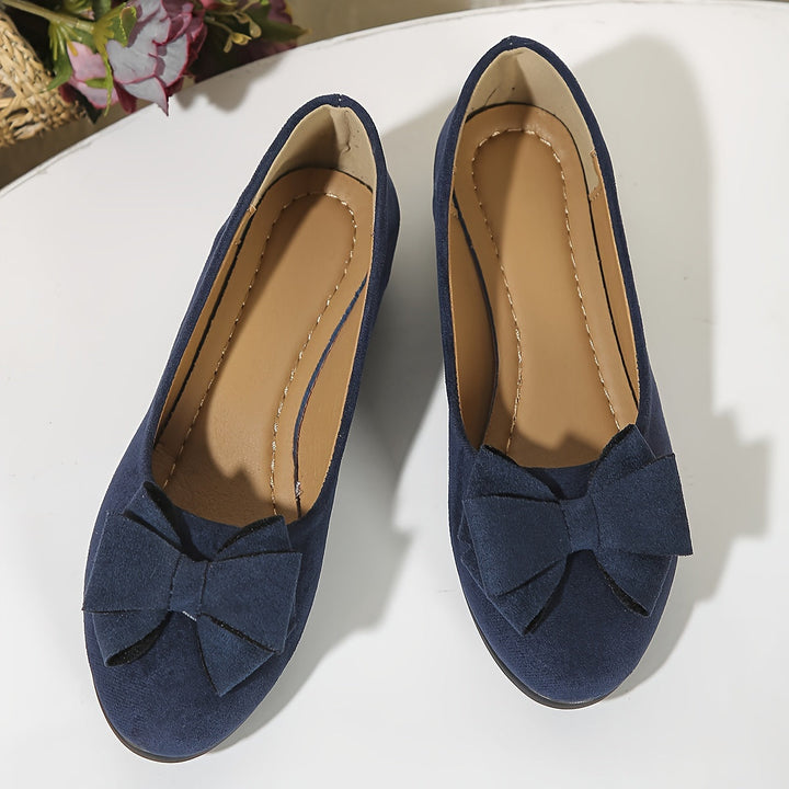 Versatile slip-on wedge ballet flats for women, with a lovely bow accent.