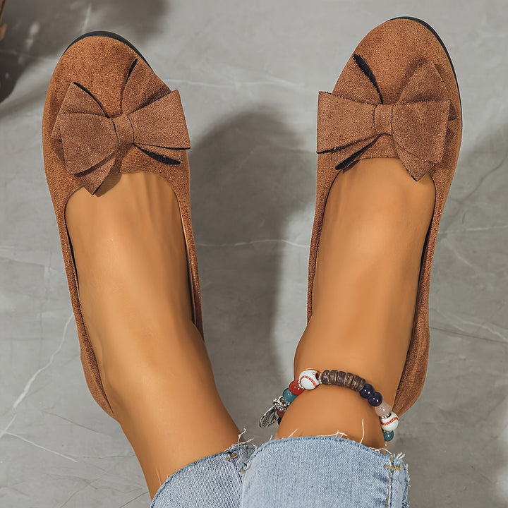 Stylish women's ballet flats, bow detail, slip-on design, perfect for daily wear.