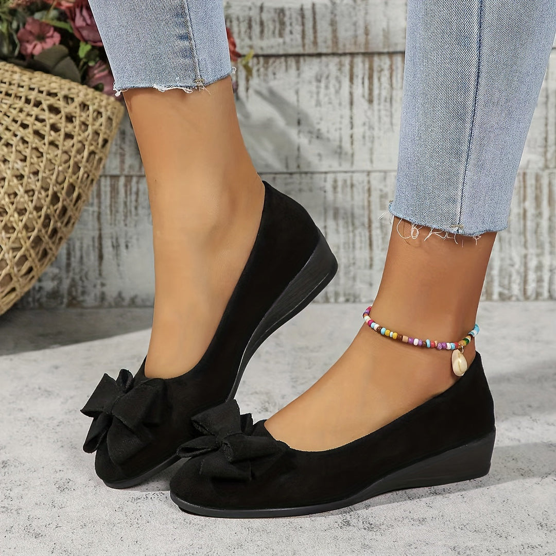 Comfortable women's round toe wedge flats, perfect for everyday wear.