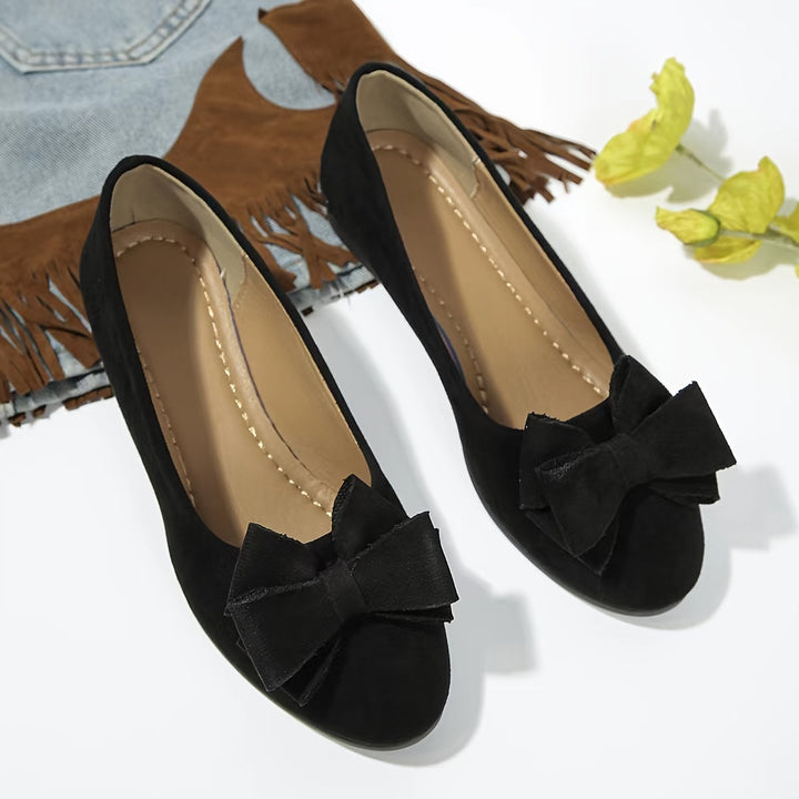 Elegant women's dress flats, bow detail, comfortable wedge for versatile outfits.