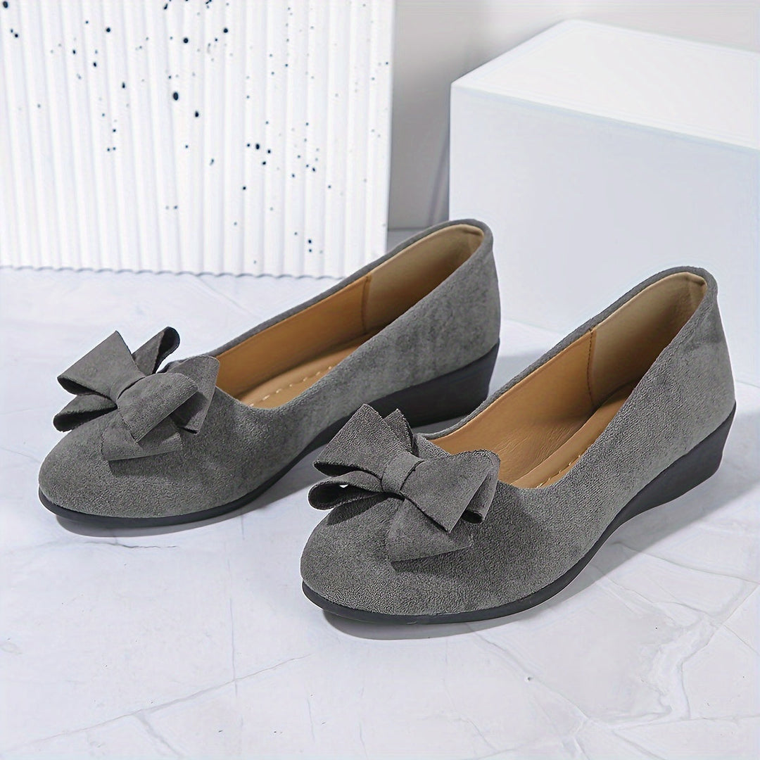 Everyday women's wedge flats, round toe, slip-on convenience, and pretty bow.