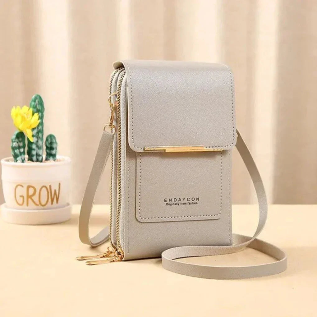 Compact women's touch screen crossbody bag, ideal for phone, cards & essentials; daily use.