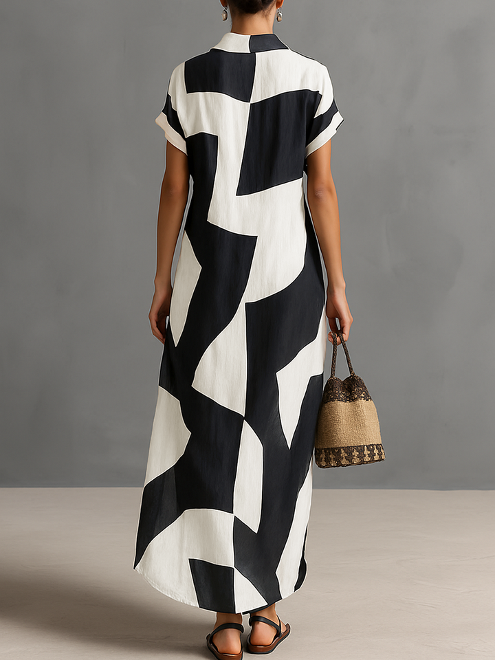 Stylish women's black & white geometric print maxi shirt dress, short sleeve, lapel, relaxed fit for summer.