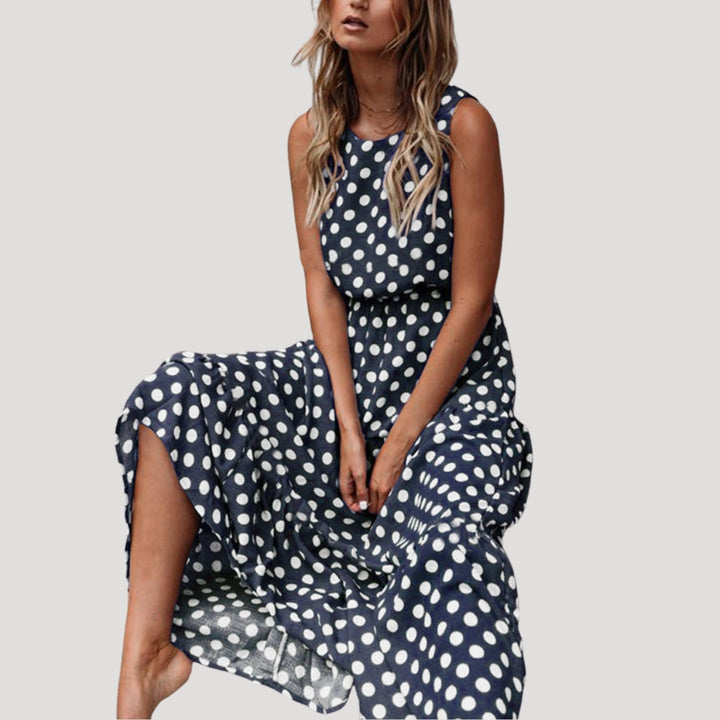 Classic women's polka dot sleeveless round neck A-line midi dress. Chic summer fashion, perfect for any occasion.