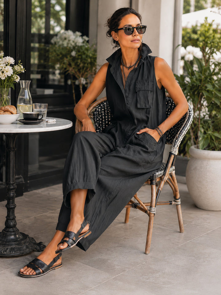 Chic women's black jumpsuit with a stylish collar and wide leg design, offering an effortless & comfortable summer outfit.
