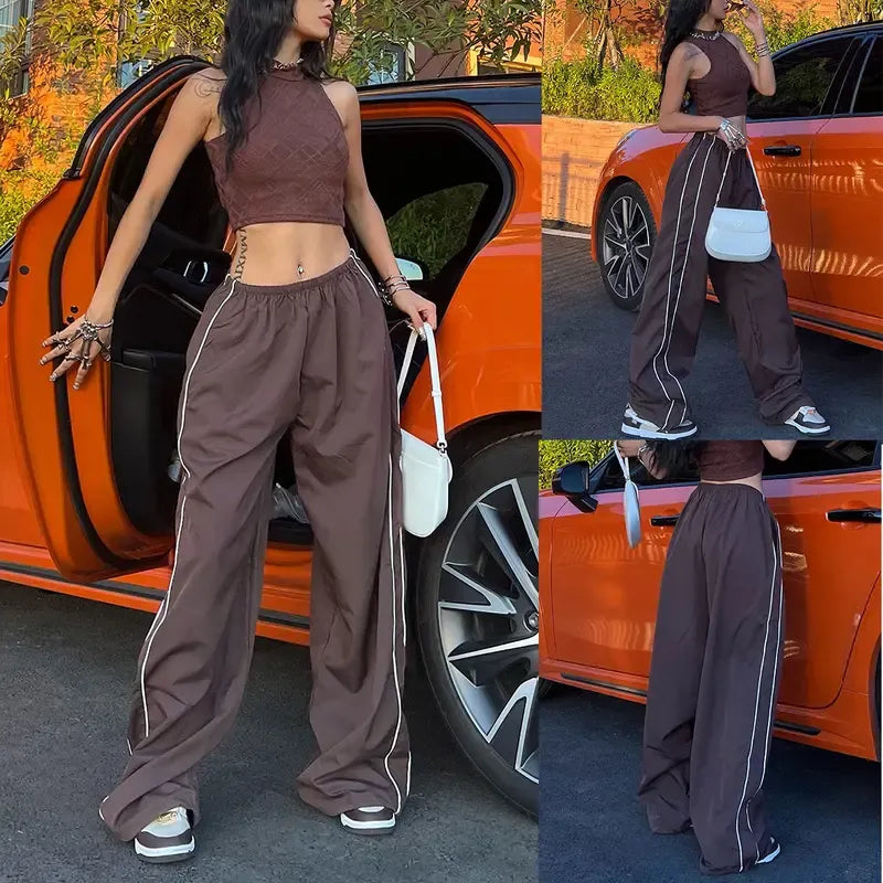 Comfortable women's athletic wide leg track pants featuring stylish contrast side piping.