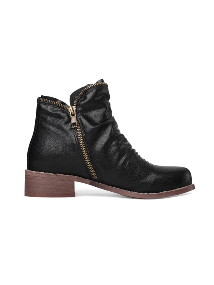 Comfortable women's black ankle boots featuring a wrinkled texture, double zippers, & low western heel.