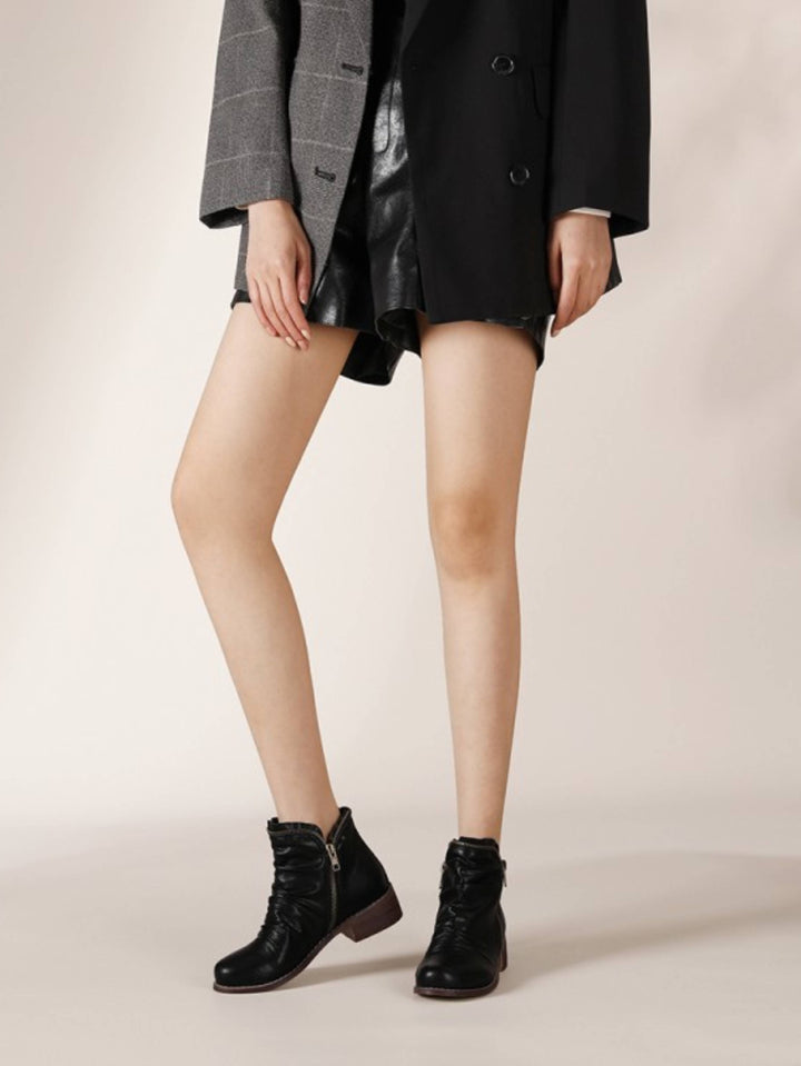 Black women's western ankle boots with a wrinkled finish, double zip access & comfortable low heel.