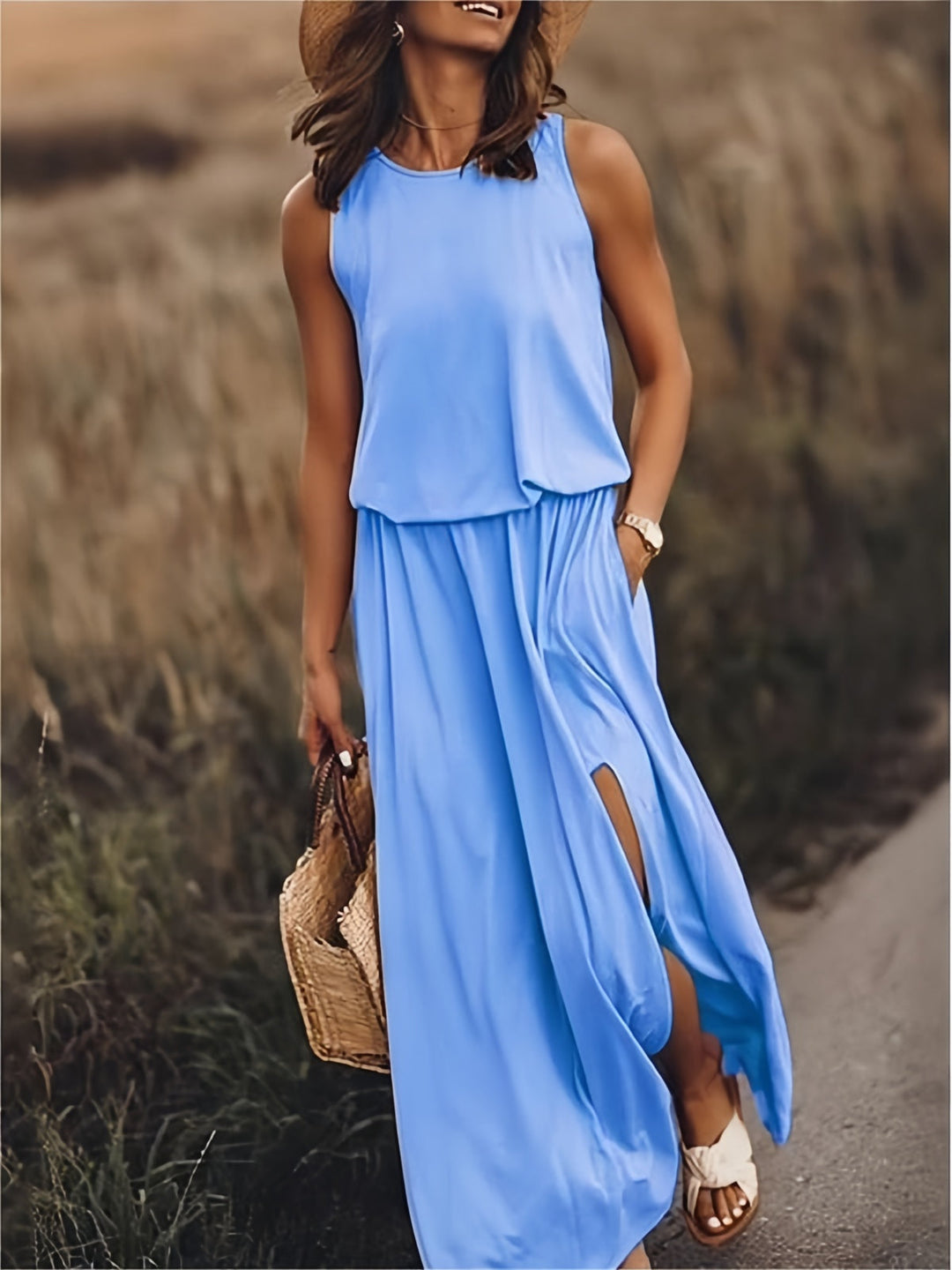 Sleeveless blouson maxi dress with elastic waist and pockets. Perfect for summer comfort.