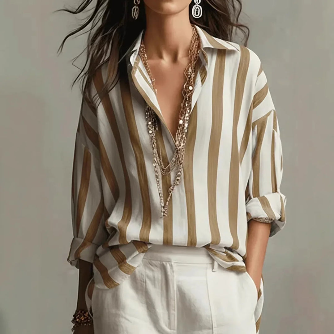 Elegant women's striped button-down shirt with a comfortable relaxed fit. Perfect classic long sleeve top for spring.