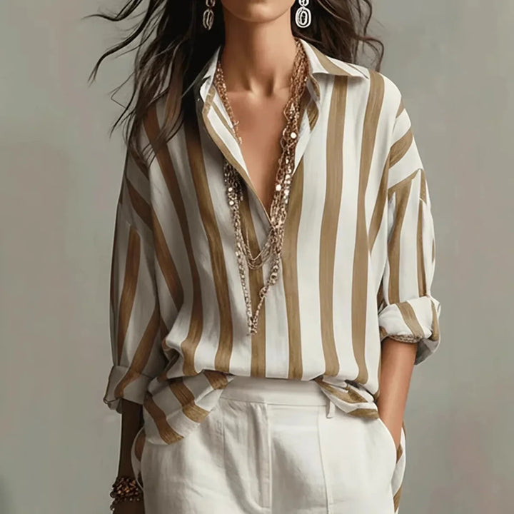 Elegant women's striped button-down shirt with a comfortable relaxed fit. Perfect classic long sleeve top for spring.
