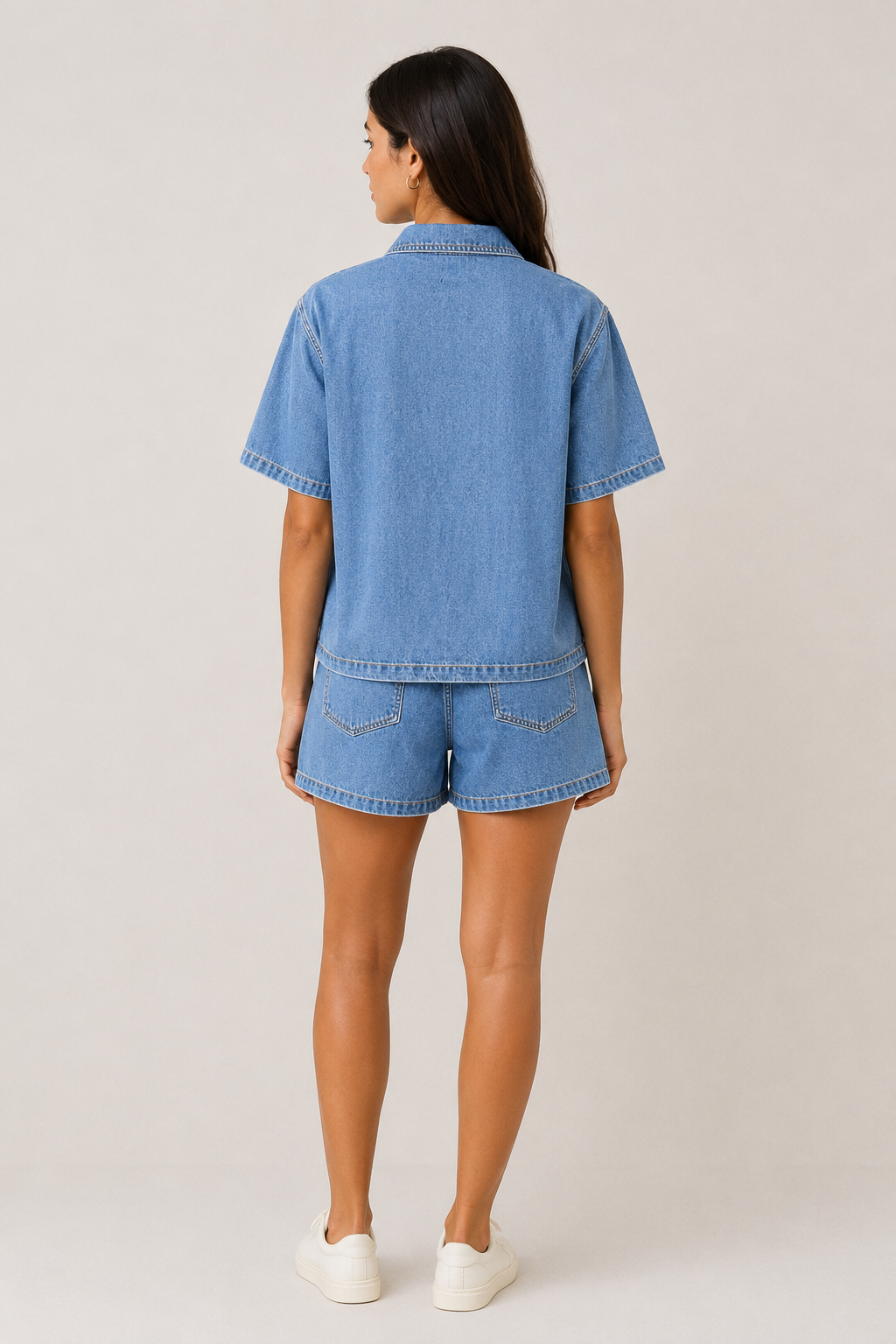Women's fashionable blue denim two-piece short set, including a jacket and shorts for summer casual chic.