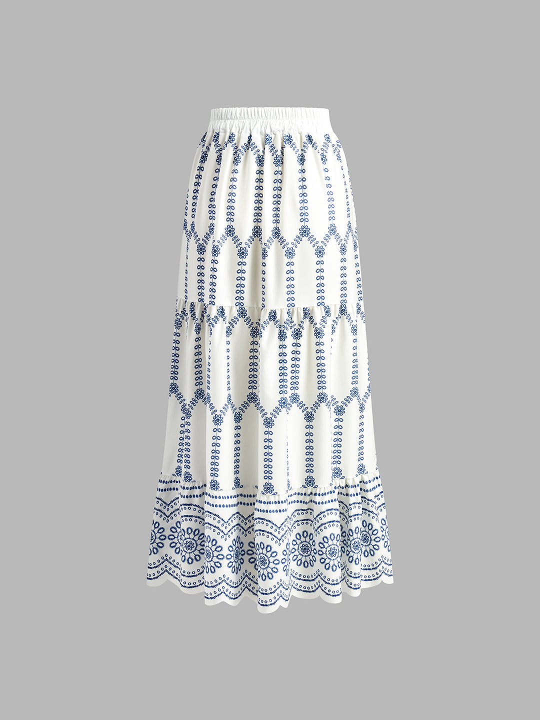 Model wearing a comfortable blue & white printed sleeveless tie-back skirt set, perfect for a sunny summer vacation day.