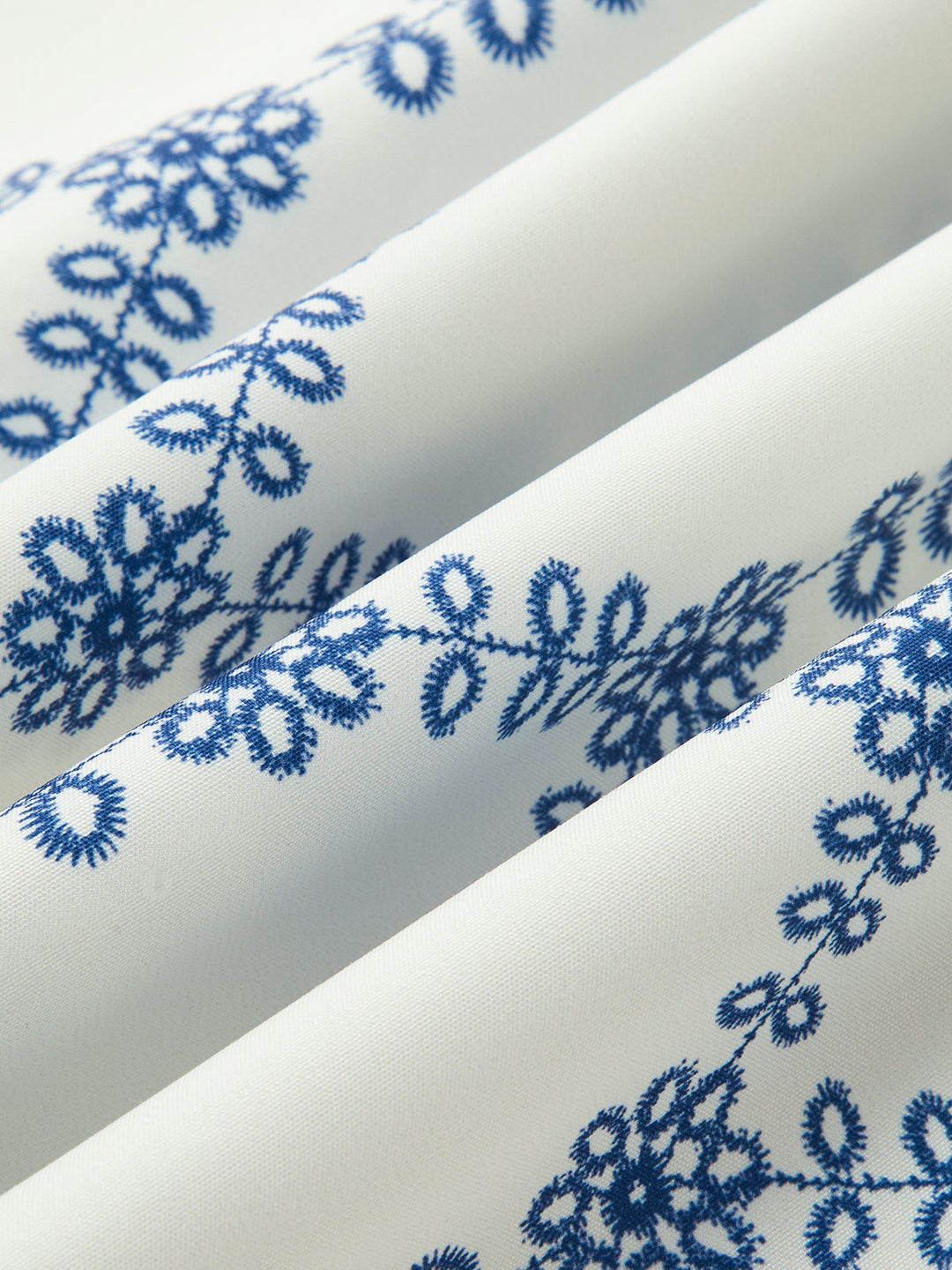 Vibrant blue & white printed sleeveless top & skirt set for women. A stylish tie-back 2-piece for trendy summer fashion.