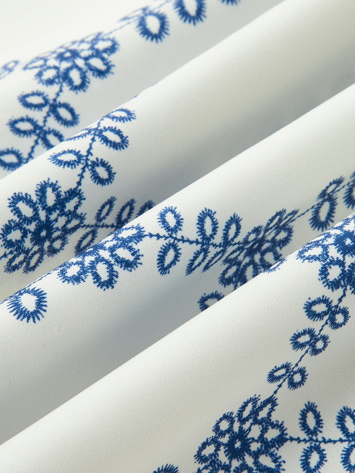 Vibrant blue & white printed sleeveless top & skirt set for women. A stylish tie-back 2-piece for trendy summer fashion.