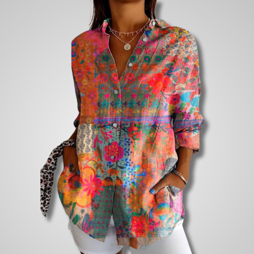 Women's bohemian button-up blouse with a vibrant artistic print. Relaxed fit for casual boho chic style.