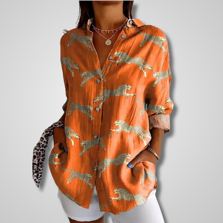 Stylish women's button-up blouse featuring a unique artistic print. Boho chic and versatile for everyday fashion.