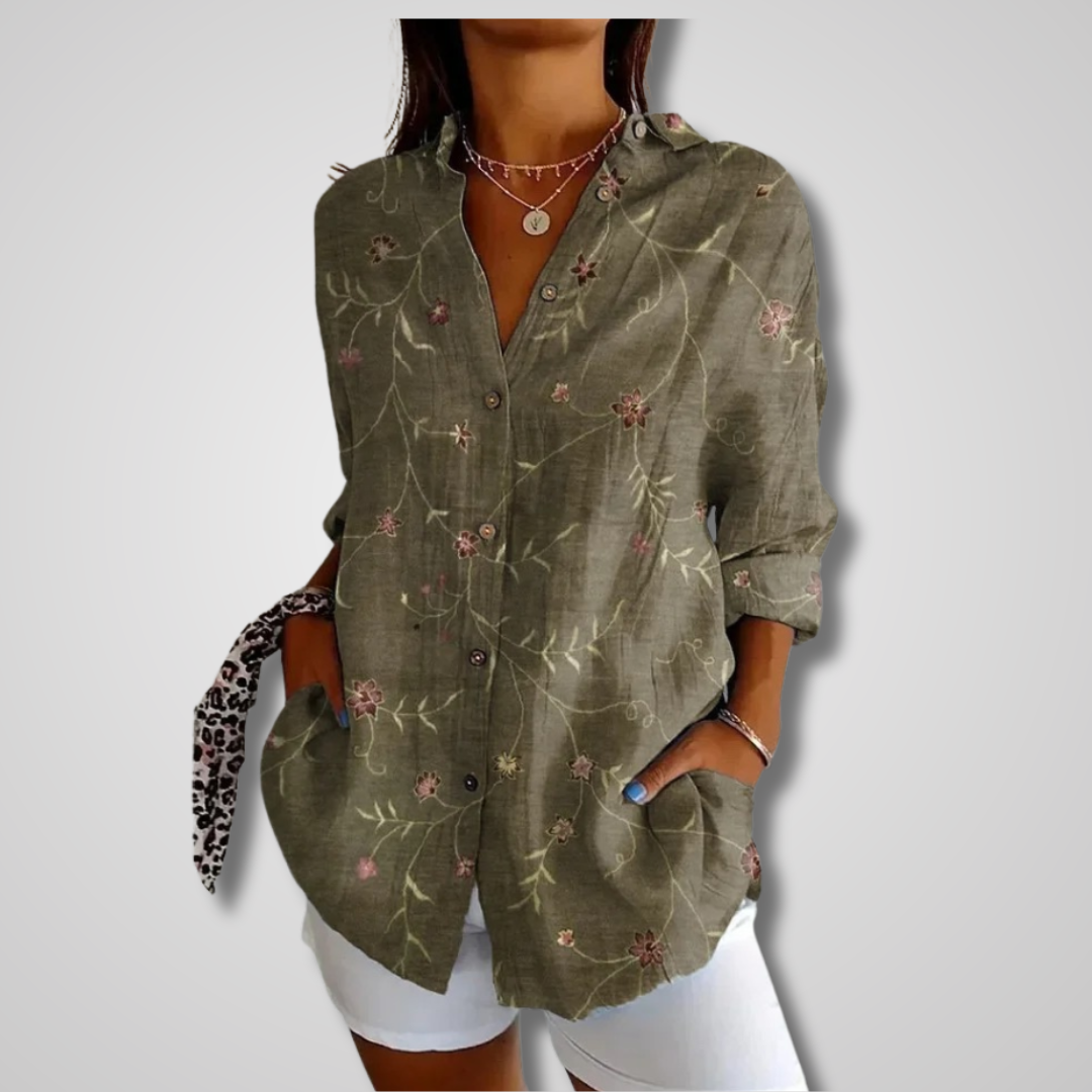 Vibrant artistic print bohemian blouse for women. Relaxed fit button-up top, comfortable for casual wear.