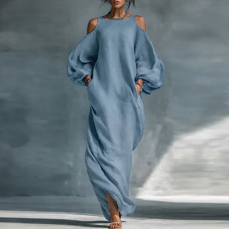 Women's bohemian cold shoulder maxi dress with elegant flow, perfect for a relaxed summer look.