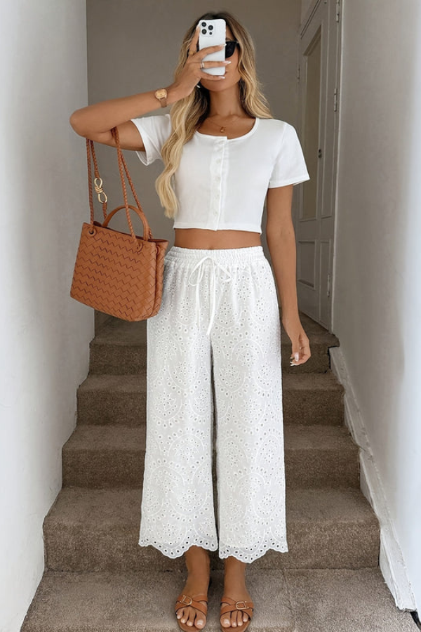 Relaxed fit women's bohemian eyelet capri pants, ideal for casual summer comfort.