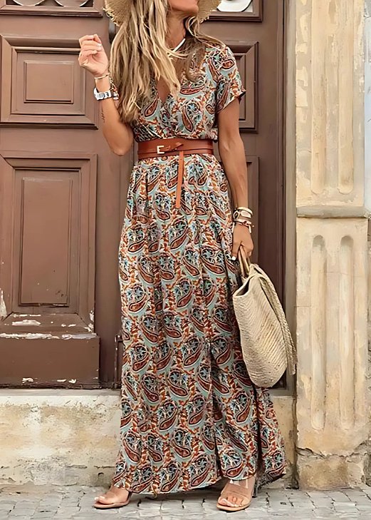Long women's bohemian floral maxi dress. V-neck, sleeveless, elegant floral print, side split. Summer style.